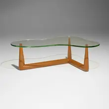 Coffee table by T. H. Robsjohn-Gibbings, c. 1950, bleached walnut, glass, brass-plated steel, sold Sep 2026