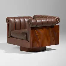 Rare swivel lounge chair by Phillip Lloyd Powell, c. 1970, sculpted walnut, leather upholstery, sold Sep 2026