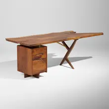 Exceptional Conoid desk by George Nakashima, 1973, English walnut, American black walnut, hickory, rosewood, sold Sep 2026