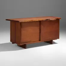 Exceptional Double Sliding Door cabinet by George Nakashima, 1970, American black walnut, oak, sold Sep 2026