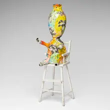 Baby with Flowers in High Chair (from the New World Series) by Michael Lucero, 1997, glazed earthenware, painted wood, sold Sep 2026