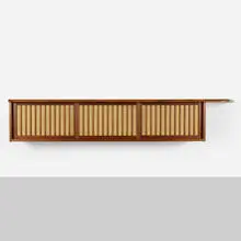 Hanging wall cabinet by George Nakashima, 1983-84, American black walnut, pandanus cloth, sold Jun 2020