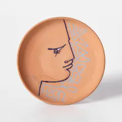 L'oeil en coin (Sideways Glance) (G. 186) by Jean Cocteau, 1957, Red earthenware ceramic plate painted with blue engobe, colored oxide crayon and colored glaze, sold Oct 2026