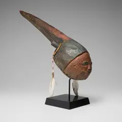 Gelede mask by Yoruba, carved wood, pigment, bamboo, beads, cowrie shells, feathers, sold Oct 2026