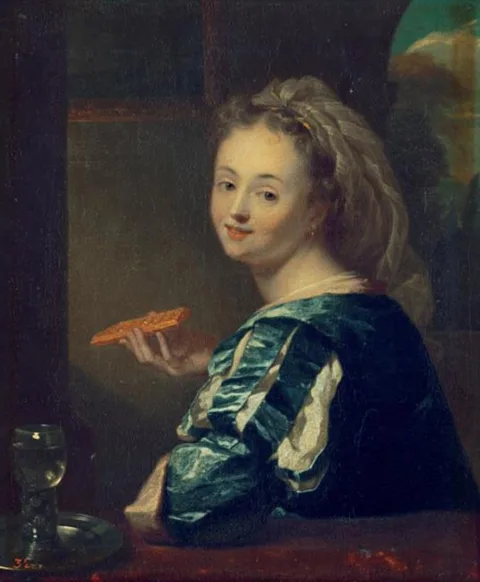 Godfried Schalcken, Young woman with a waffle