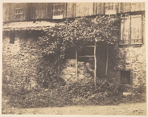 André Giroux, [Rustic Building with Man under Trellis]