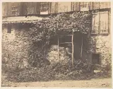 André Giroux, [Rustic Building with Man under Trellis]