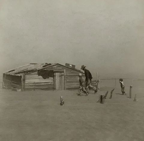 Arthur Rothstein, Farmer and Sons Walking in the Face of a Dust Storm