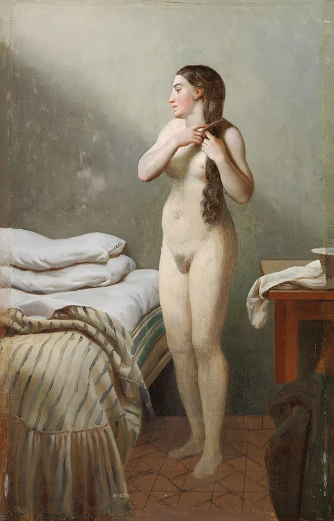 Christoffer Wilhelm Eckersberg, A female standing by a bed, combing her hair.