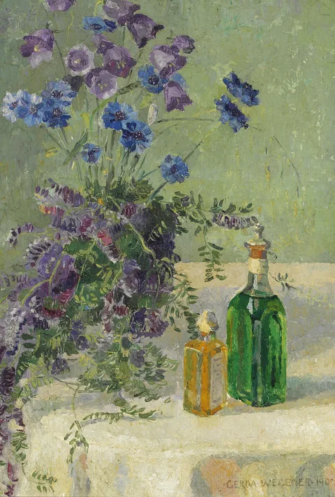 Gerda Wegener, Still life with blue flowers and two bottles on a table