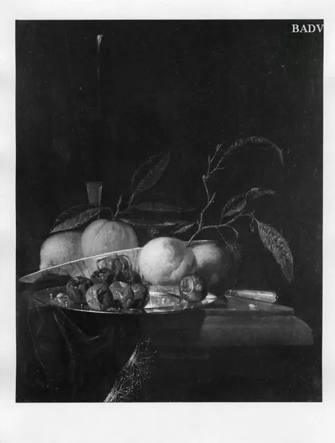 Juriaen van Streeck, A lemon and orange in a porcelain bowl, a glass of wine, dates on a silver plate, an apple, a peach and a knife, all on a partially draped table