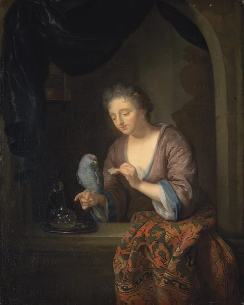 Arnold Boonen, A lady feeding a parrot at a window casement