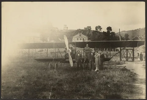 Fedele Azari, [Group portrait in front of airplane]