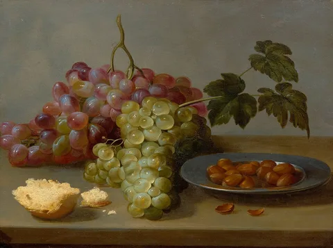 Jacob van Es, Still life with grapes and hazel nuts on a table