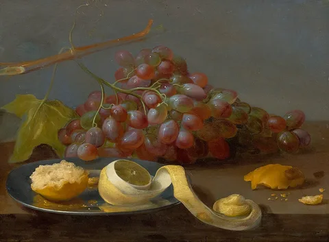Jacob van Es, Still life with grapes, a lemon and bread on a table