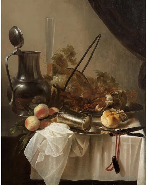 Cornelis Kruys, A pewter jug with an overturned silver cup with fruit, bread and meat on a draped table-top