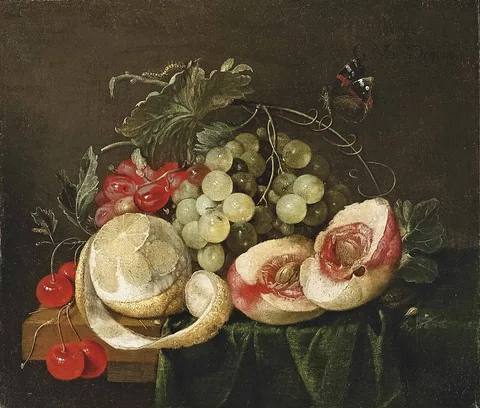 G. van Deynum, A peeled lemon, open peach, grapes and cherries, with a butterfly, on a partly-draped table