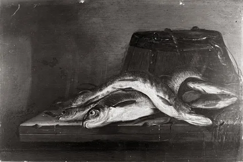 Jan Dirven, Still life of a pike and a common nase on a wooden table, with a wooden bucket, a net and a frogbit stolon
