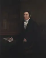 William Shiels, Man sitting at a table with an open book