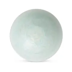 A Fine Chinese Carved Qingbai 'Boys' Bowl, Northern Song Dynasty, The thinly potted bowl is carved on the interior with two boys amidst peony scroll and covered overall with a pale bluish-green glaze. It's with a fitted box.